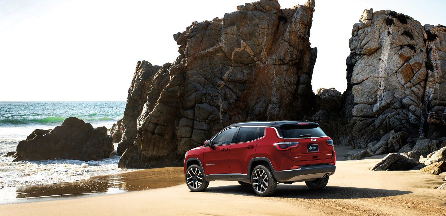 A refined and athletic profile lets the Jeep Compass stand out on sandy shores and city streets. 